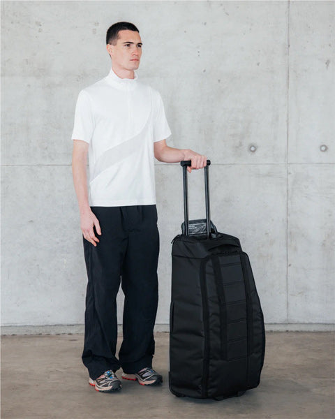 Hugger Roller Bag Check-in 60L / Black Out