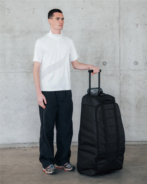 Hugger Roller Bag Check-in 90L / Black Out